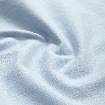 Macro texture swatch shot of light blue linen fabric showcasing the precise thread count and weave density.